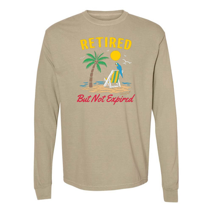 Khaki blue long-sleeve shirt with a beach graphic and 'Retired But Not Expired' text.