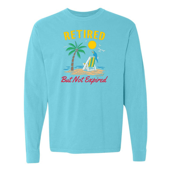 Blue long-sleeve shirt with a beach graphic and 'Retired But Not Expired' text.