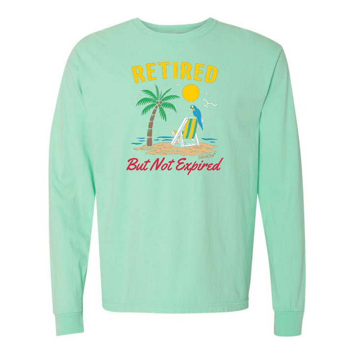 Mint green long-sleeve shirt with a beach graphic and 'Retired But Not Expired' text.