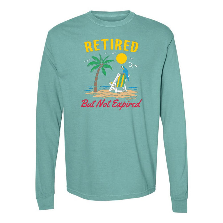 Teal long-sleeve shirt with a beach graphic and 'Retired But Not Expired' text.