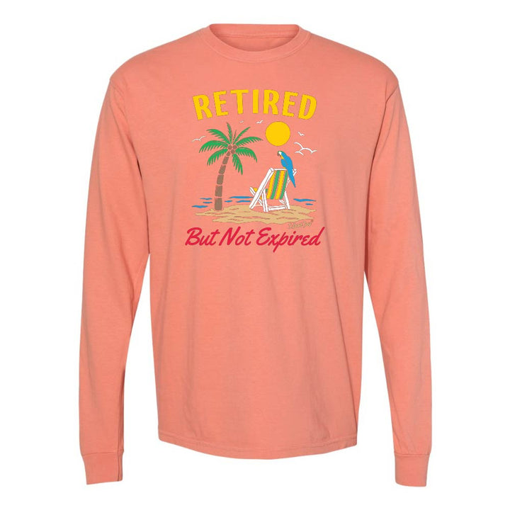 Light orange long-sleeve shirt with a beach graphic and 'Retired But Not Expired' text.