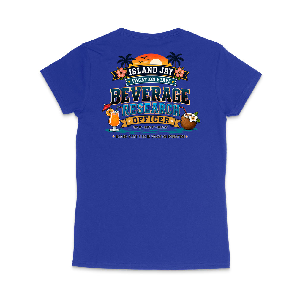 A royal blue short-sleeve t-shirt shown from the back, featuring a colorful graphic print with tropical island-themed text reading 'ISLAND JAY VACATION STAFF BEVERAGE RESEARCH OFFICER' and cartoon illustrations of a cocktail, coconut, and flowers.