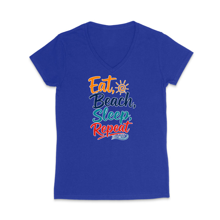 A royal blue women's V-neck t-shirt with a colorful retro-style graphic on the chest that reads 'Eat, Beach, Sleep, Repeat' in orange, dark blue, and red lettering, with a small sun icon and 'BAYOU' in a blue wave graphic below.