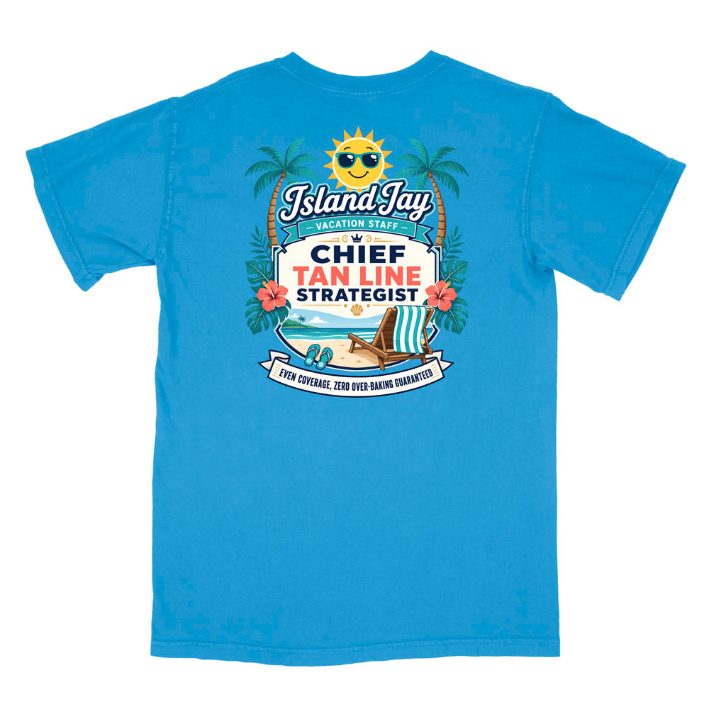 A blue short-sleeve t-shirt with a colorful graphic print on the front. The graphic features a smiling sun wearing sunglasses, palm trees, a beach scene, and text that reads 'Island Jay Vacation Staff by CHIEF TAN LINE STRATEGIST'.