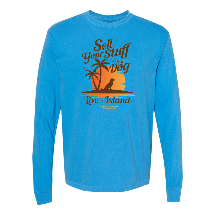 Blue long-sleeve shirt with a graphic design and text on a white background
