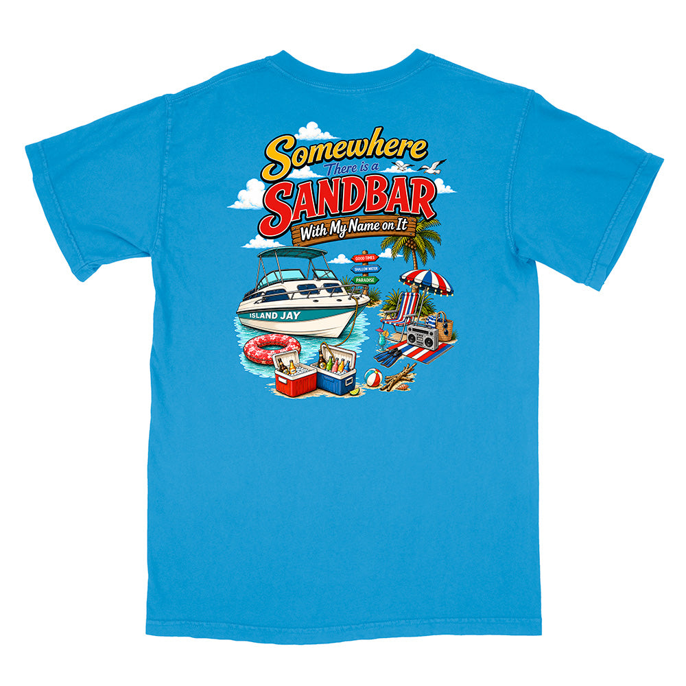 A bright blue short-sleeve t-shirt shown flat against a white background, featuring a colorful graphic print on the front with the text 'Somewhere in the Sandbar With My Name on It' and beach-themed illustrations.