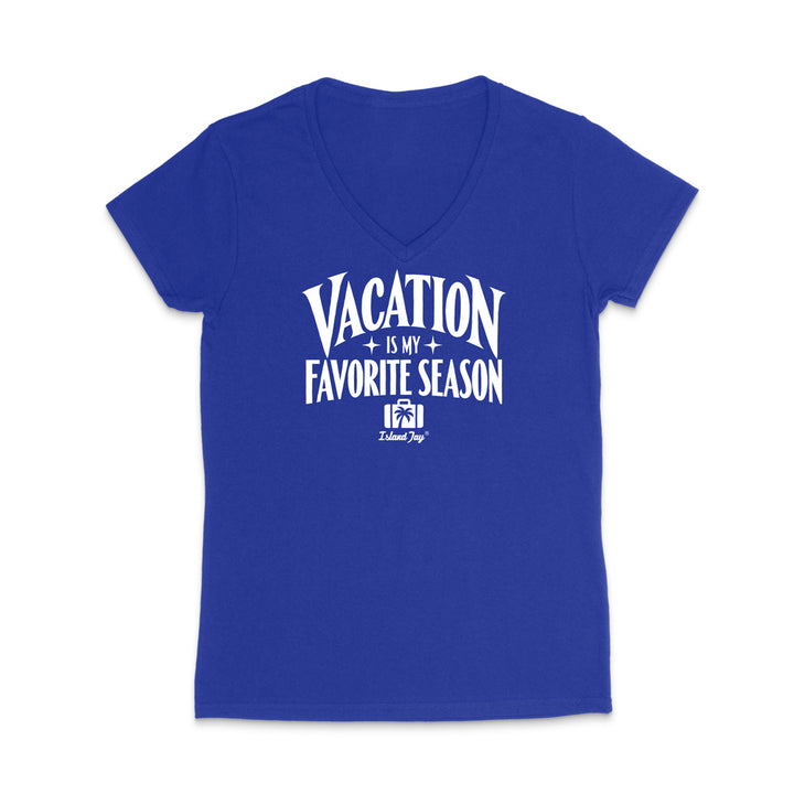 A royal blue women's V-neck t-shirt with a white graphic print on the front that reads 'VACATION IS MY FAVORITE SEASON' with a small 'Island Trip' logo underneath, displayed on a clean white background.