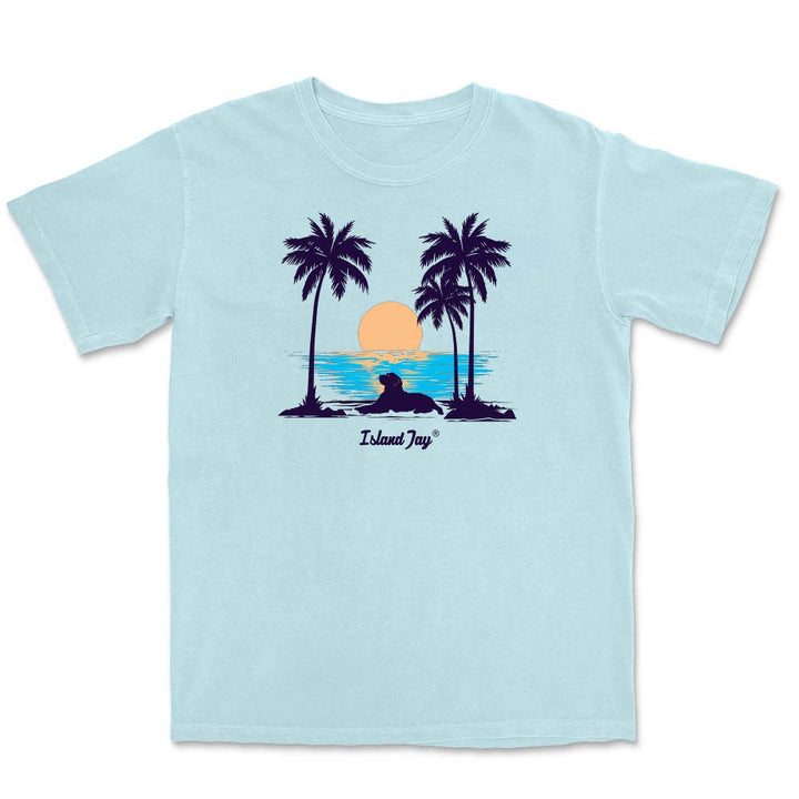 Light blue t-shirt with palm tree and sunset design on a white background