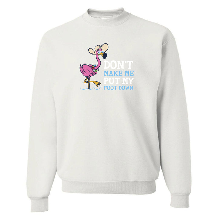 White sweatshirt with a flamingo graphic and text on a white background