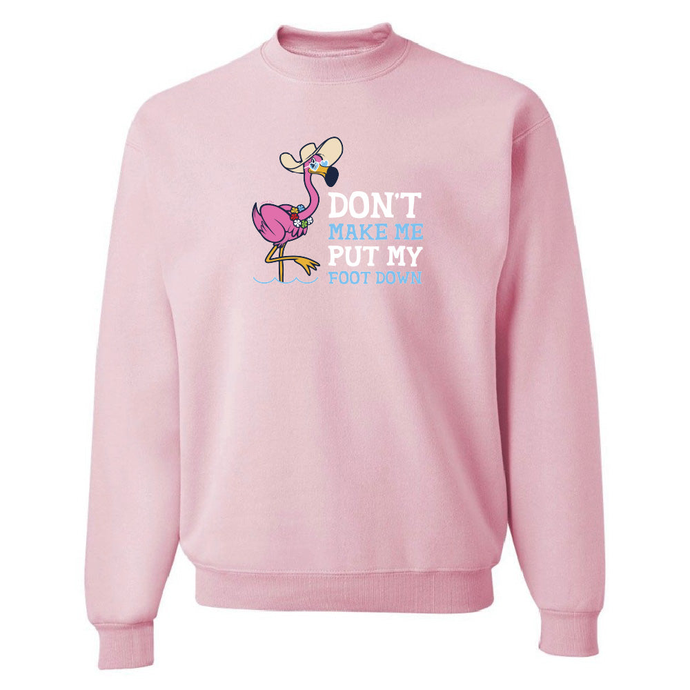 Pink sweatshirt with a flamingo graphic and text on a white background