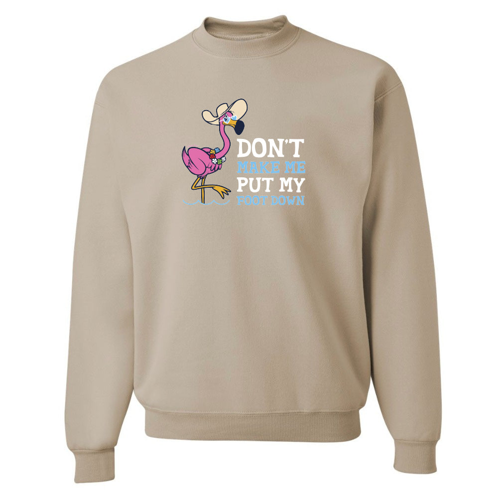 Beige sweatshirt with a cartoon flamingo and text on a white background