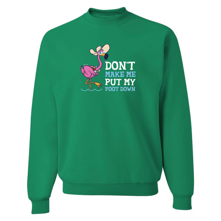 Green sweatshirt with cartoon flamingo and text on a white background