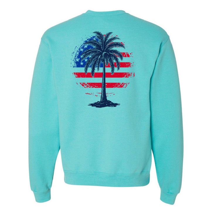 Turquoise sweatshirt with a palm tree design on the back featuring an American flag pattern.