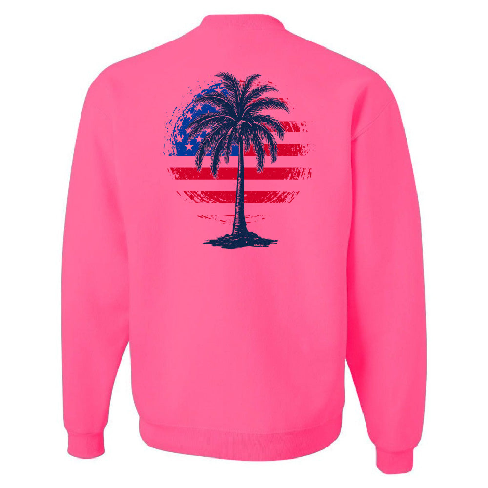 Pink sweatshirt with a palm tree design on the back against a white background
