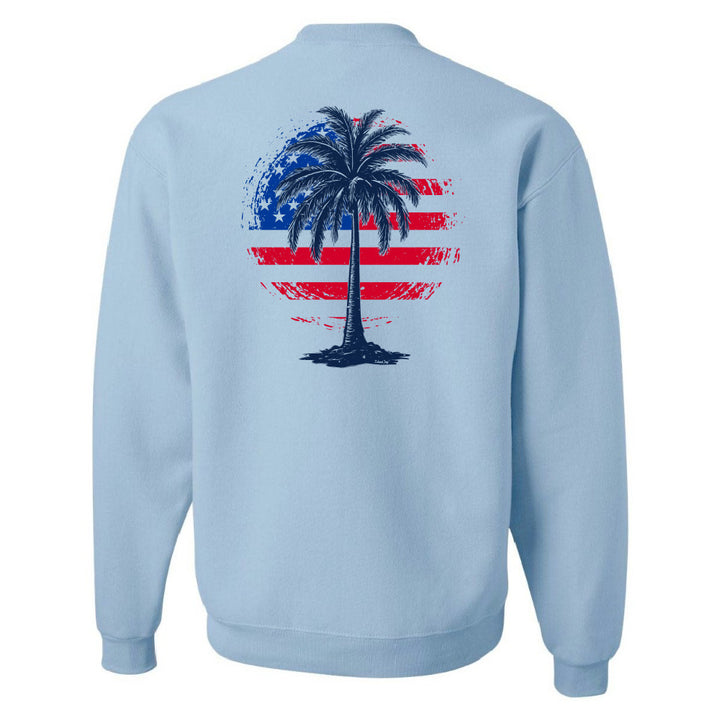 Light blue sweatshirt with a palm tree design on the back featuring an American flag pattern.