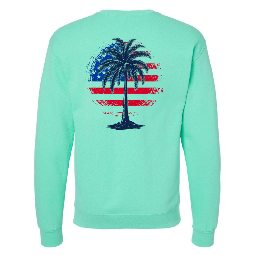 Mint green sweatshirt with a palm tree design on the back featuring an American flag.
