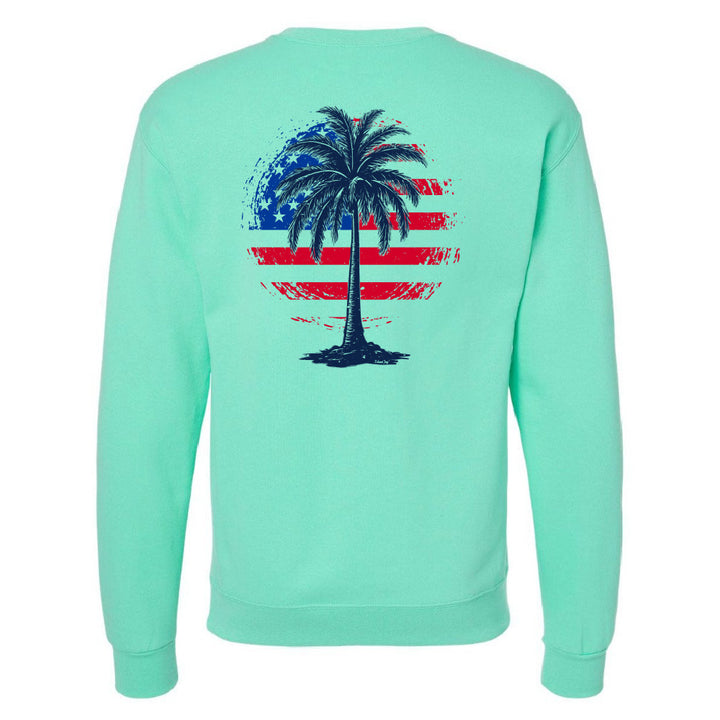 Mint green sweatshirt with a palm tree design on the back featuring an American flag.
