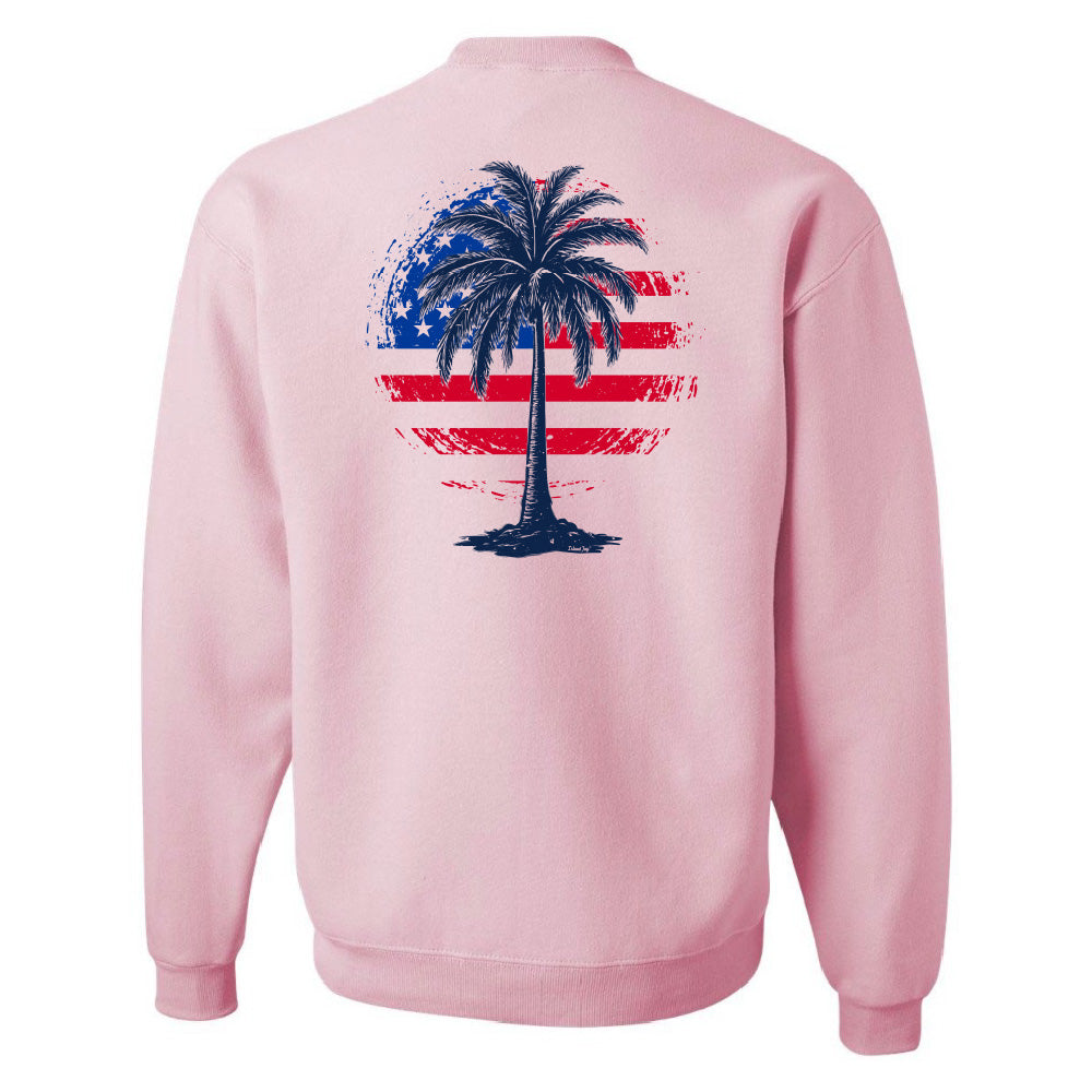 Pink sweatshirt with a palm tree design on the back featuring an American flag pattern.