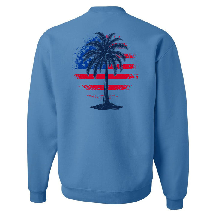 Blue sweatshirt with a palm tree and American flag design on the back against a white background