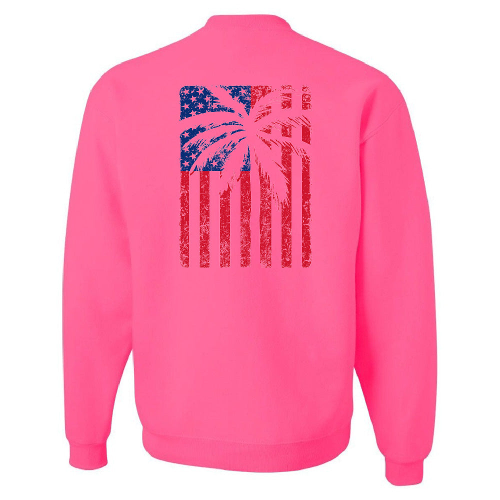 Pink sweatshirt with a palm tree and American flag design on the back against a white background