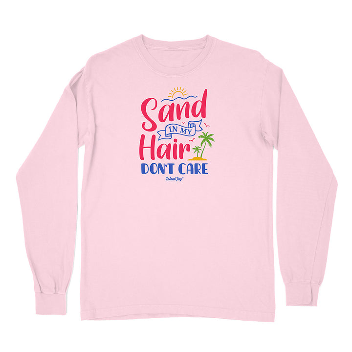 Pink long-sleeve shirt with 'Sand in My Hair Don't Care' text and graphics on a white background