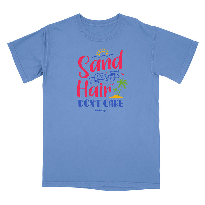 Blue t-shirt with 'Sand in My Hair Don't Care' text design on a white background