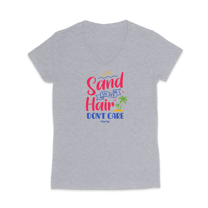Grey t-shirt with colorful text reading "Sand In My Hair Don't Care" on a white background
