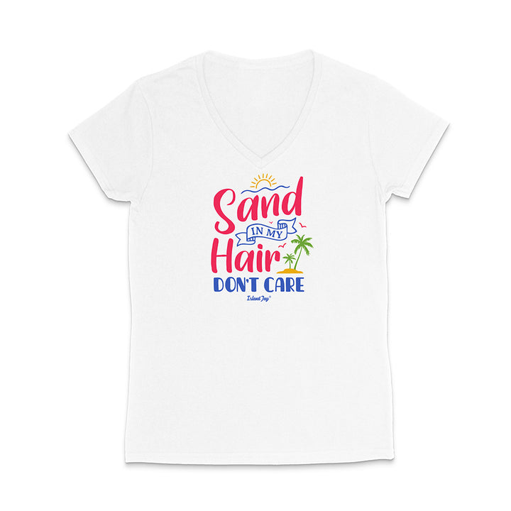 White t-shirt with colorful text reading "Sand In My Hair Don't Care" on a white background