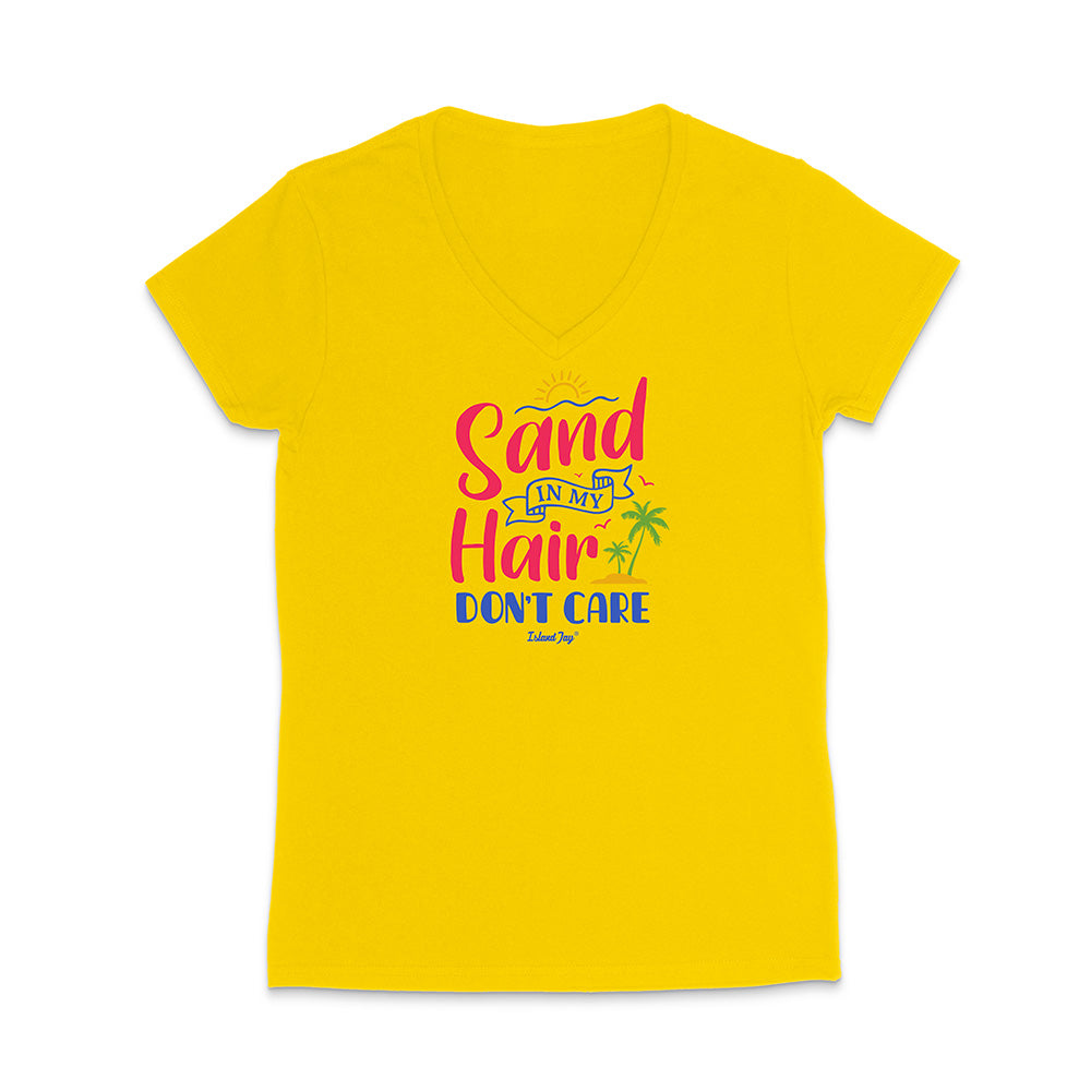 Yellow t-shirt with colorful text reading "Sand In My Hair Don't Care" on a white background