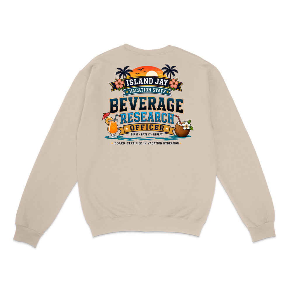 A beige crewneck sweatshirt shown from the back, featuring a colorful graphic print with tropical island elements and the text 'ISLAND JAY BEVERAGE RESEARCH OFFICER'.