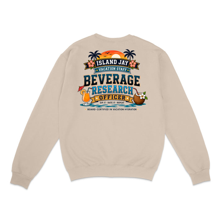 A beige crewneck sweatshirt shown from the back, featuring a colorful graphic print with tropical island elements and the text 'ISLAND JAY BEVERAGE RESEARCH OFFICER'.