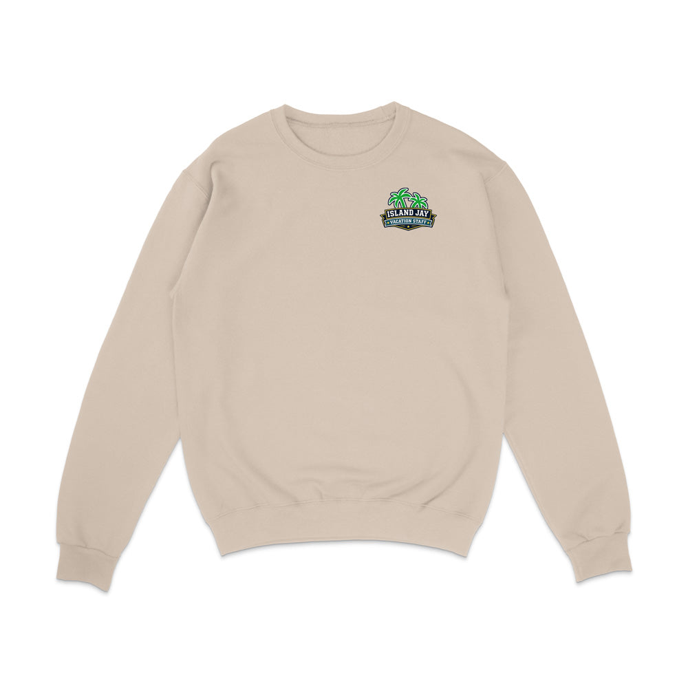 A beige crewneck sweatshirt with a small colorful graphic on the left chest featuring a green palm tree and the text 'GREEN PALMS COLUMBINE', displayed on a clean white background.