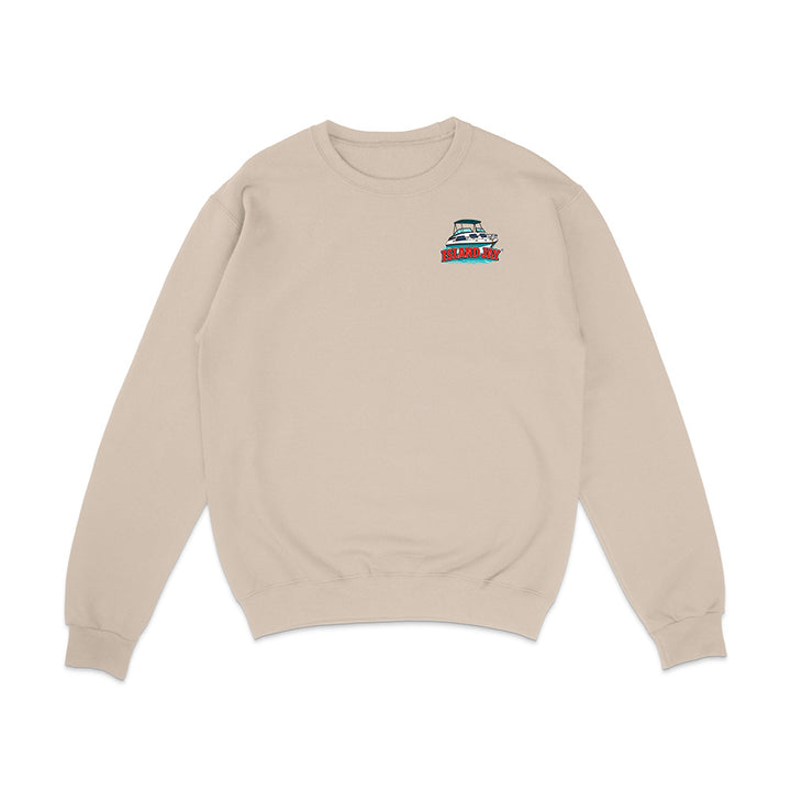 A light beige crewneck sweatshirt with a small graphic of a red and blue boat on the left chest, displayed on a clean white background.