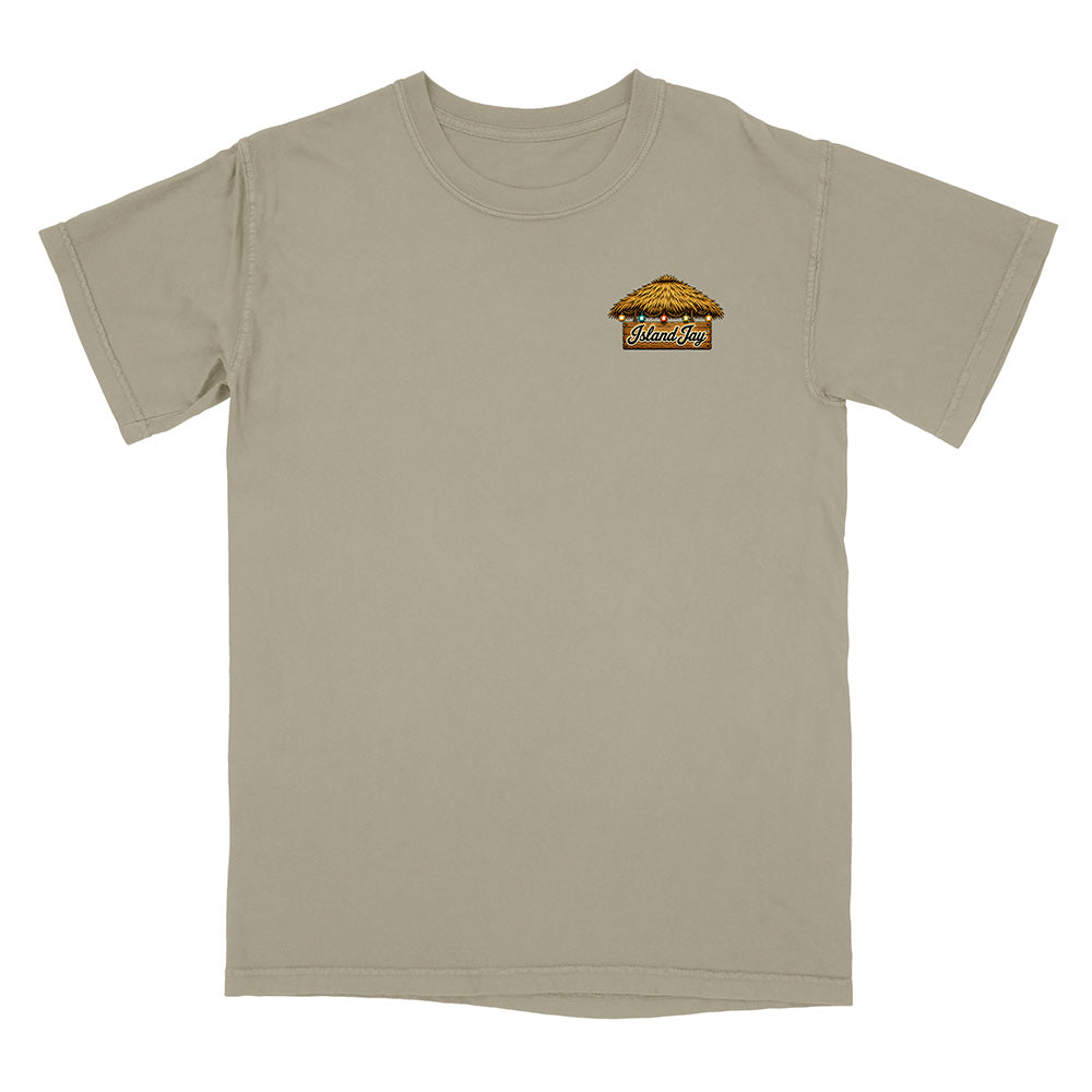 A short-sleeve crewneck t-shirt in a light khaki-beige color, featuring a small graphic on the left chest depicting a small house with the text 'Wanderers' in a stylized font.