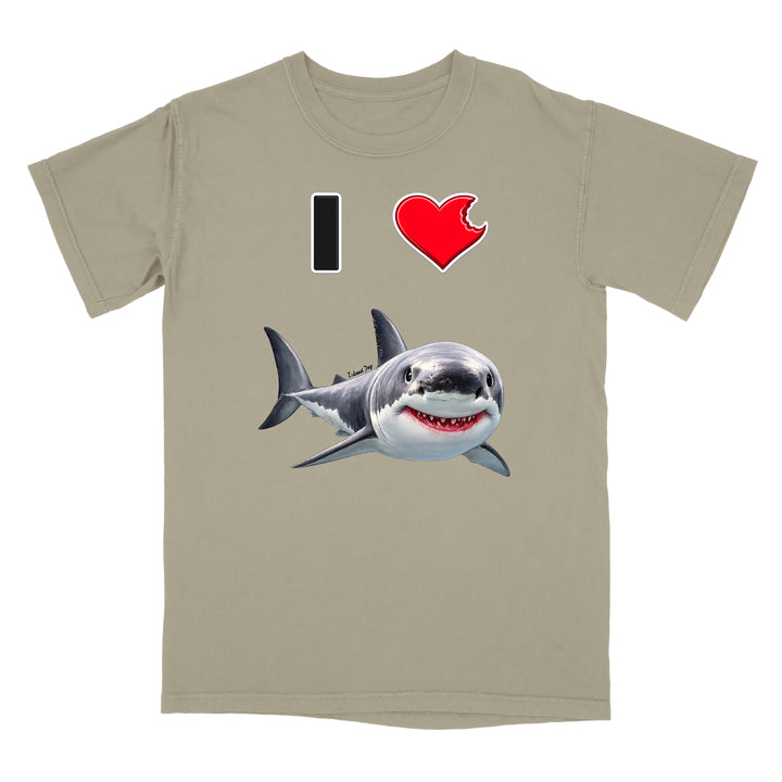 A beige crewneck t-shirt featuring a graphic print of a smiling great white shark below a text design that reads 'I' followed by a red heart.