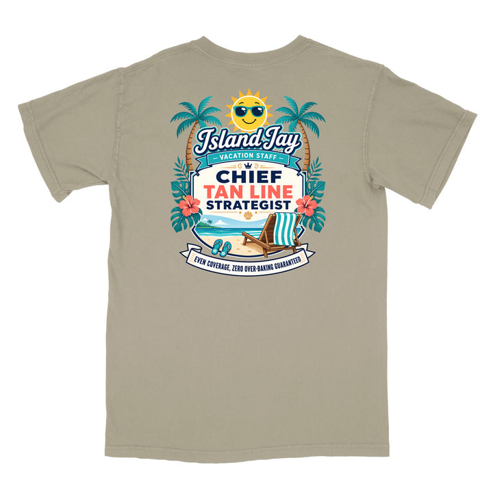 A grey short-sleeve t-shirt with a colorful graphic print on the front. The graphic features a smiling sun wearing sunglasses, palm trees, a beach scene, and text that reads 'Island Jay Vacation Staff by CHIEF TAN LINE STRATEGIST'.