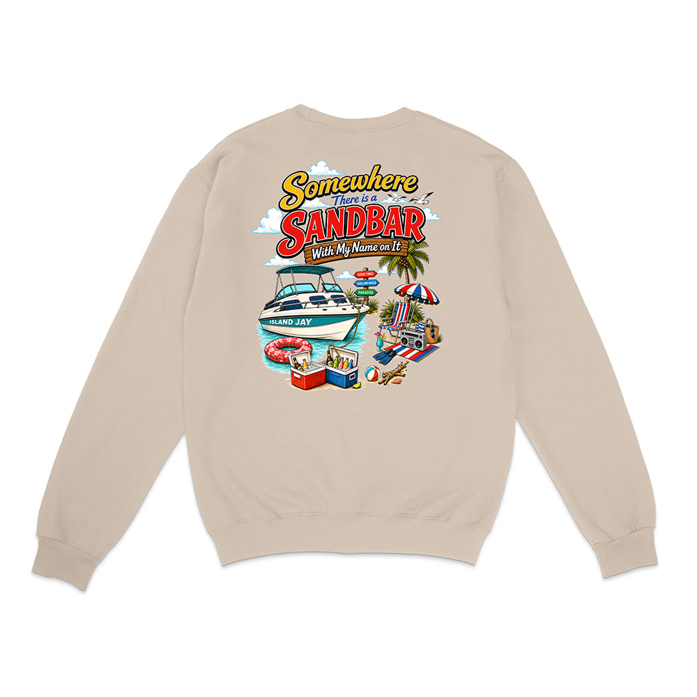 A beige crewneck sweatshirt shown from the back, featuring a colorful graphic print with the text 'Somewhere There is a SANDBAR' and illustrations of a boat, beach chair, palm tree, and pool.