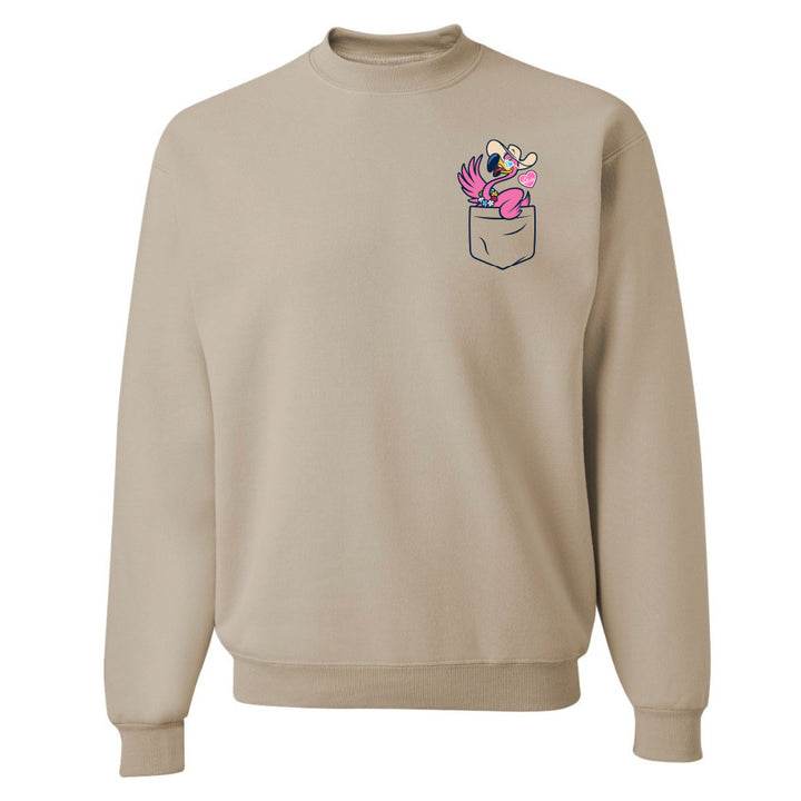 Beige sweatshirt with a graphic of a pocket and cartoon character on a white background