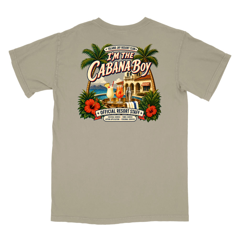 A light beige crewneck t-shirt with a large colorful graphic on the front. The graphic features palm trees, red hibiscus flowers, a resort building, a cocktail, and text reading 'I'm The Cabana Boy' and 'Official Resort Staff'.