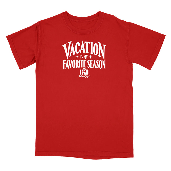 A red short-sleeve crewneck t-shirt with a white graphic print on the front that reads 'VACATION IS MY FAVORITE SEASON' with a small cabin graphic and 'Deluxe Designs' logo underneath, shown on a plain white background.