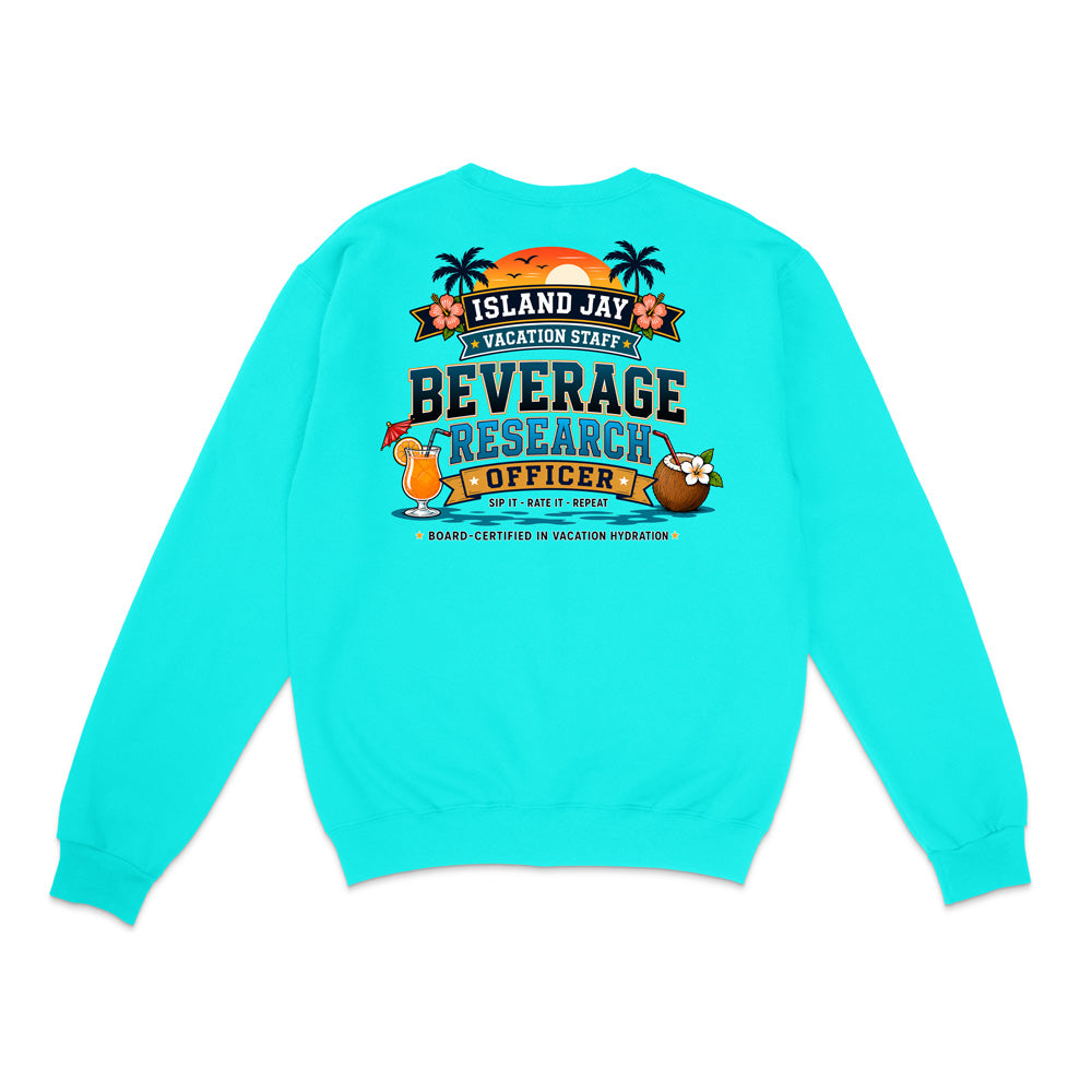 A turquoise crewneck sweatshirt shown from the back, featuring a colorful graphic print with tropical island illustrations and the text 'ISLAND JAY BEVERAGE RESEARCH OFFICER'.