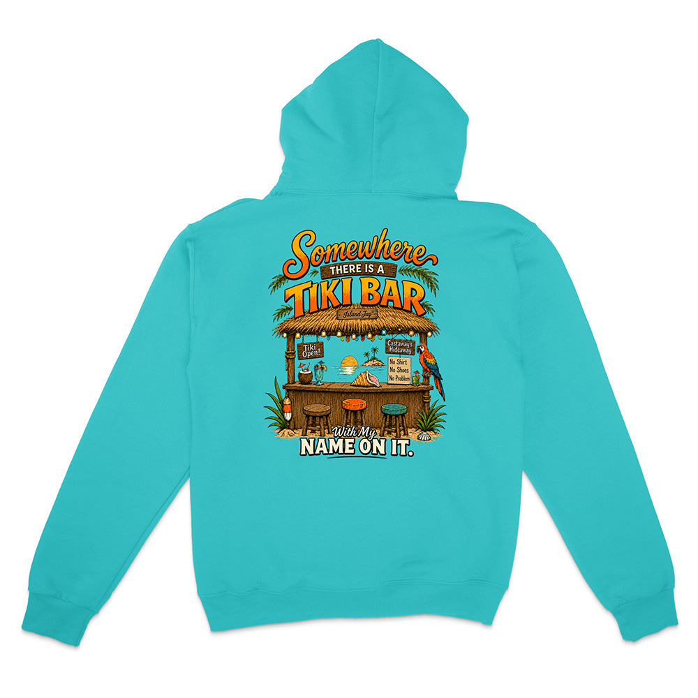 A turquoise blue hoodie shown from the back, featuring a colorful graphic of a tropical 'Tiki Bar' with the text 'Somewhere There Is A TIKI BAR' and 'NAME ON IT.'.