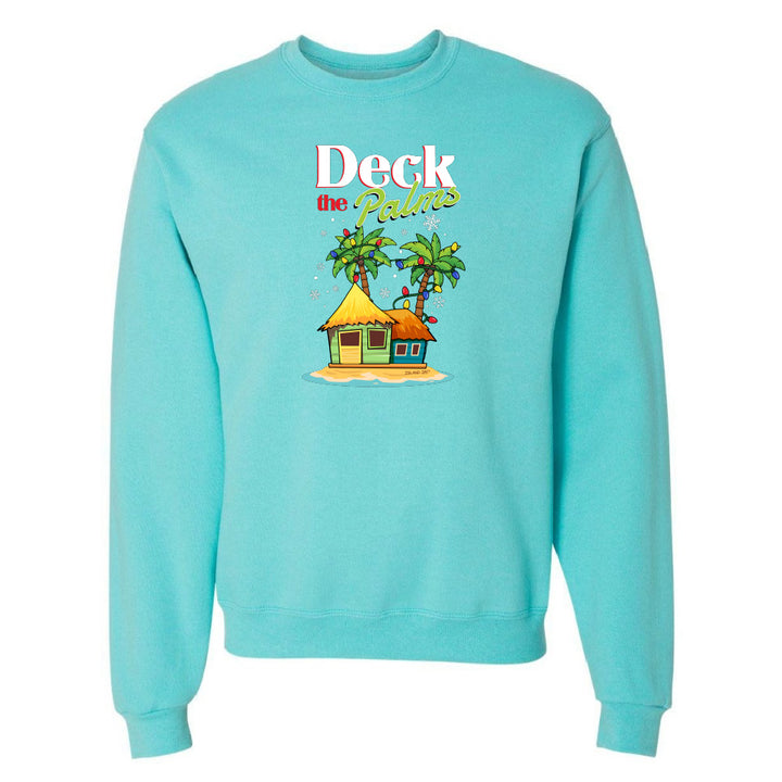 Blue sweatshirt with a tropical hut and palm tree design and graphic text reading "Deck The Palms" on a white background