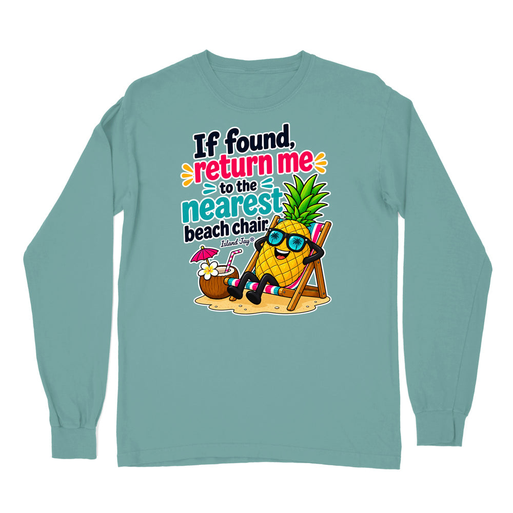 A long-sleeve crewneck t-shirt in a muted teal color, featuring a colorful graphic print on the front of a pineapple wearing sunglasses and relaxing in a beach chair next to a cocktail, with the text 'If found, return me to the nearest beach chair' and 'Florida'.