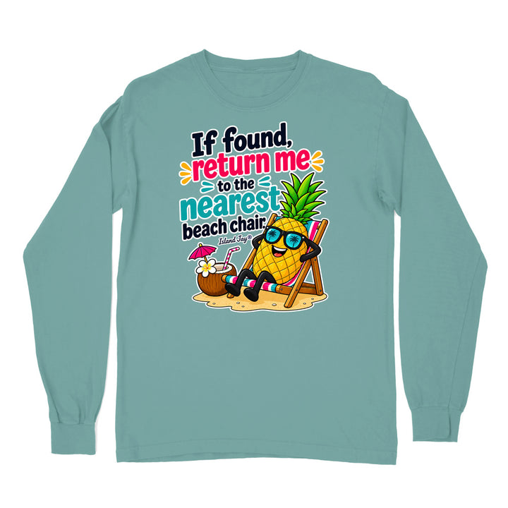 A long-sleeve crewneck t-shirt in a muted teal color, featuring a colorful graphic print on the front of a pineapple wearing sunglasses and relaxing in a beach chair next to a cocktail, with the text 'If found, return me to the nearest beach chair' and 'Florida'.