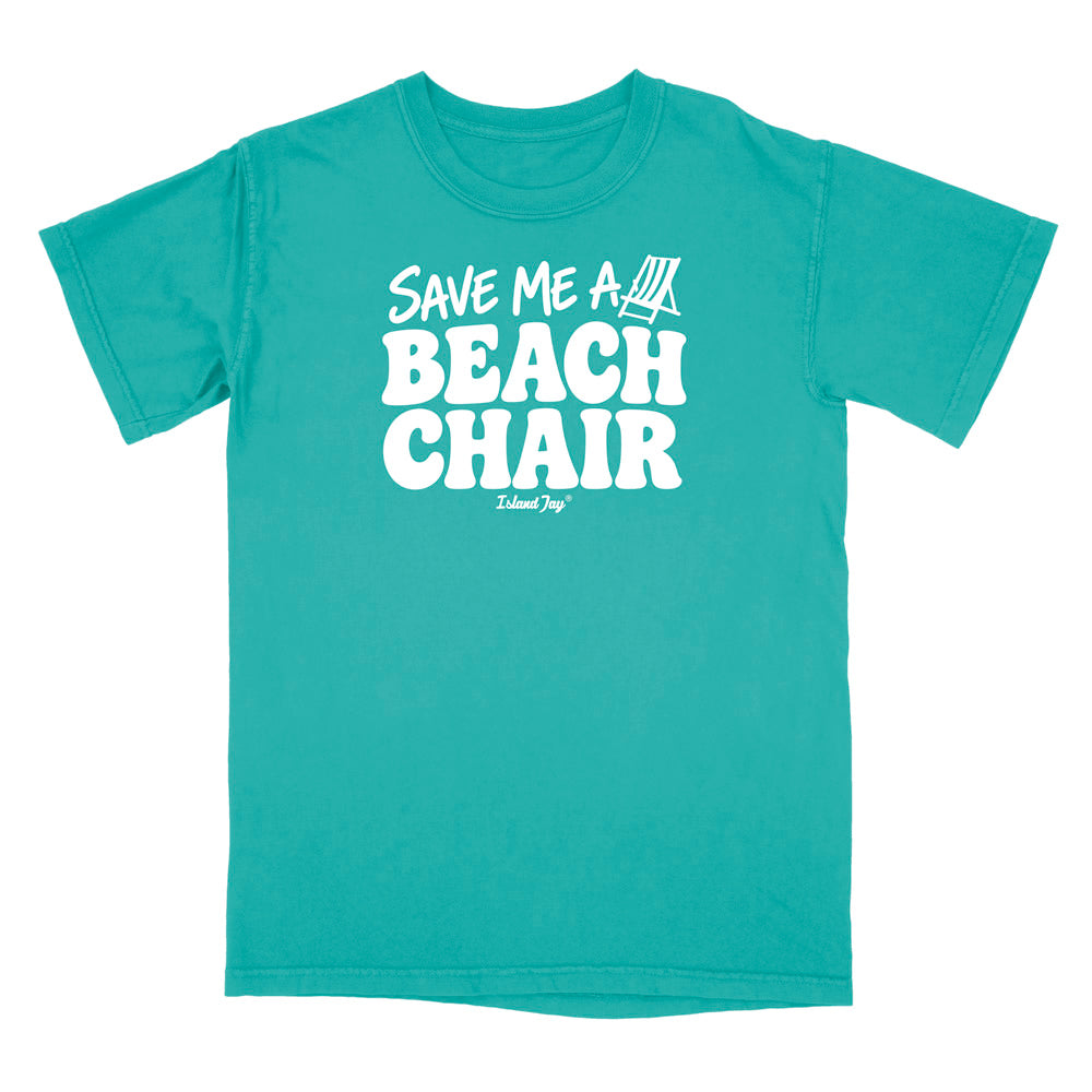 A teal short-sleeve crewneck t-shirt with a bold white graphic on the chest reading 'SAVE ME A BEACH CHAIR' 
