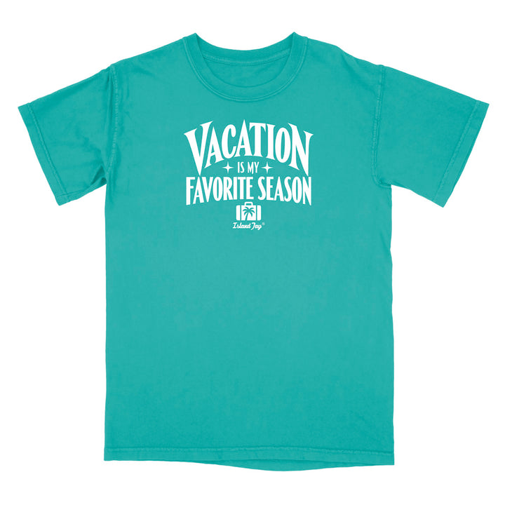 A teal short-sleeve crewneck t-shirt with a white graphic print on the front that reads 'VACATION IS MY FAVORITE SEASON' with a small 'Delmarc Shop' logo underneath, shown against a plain white background.