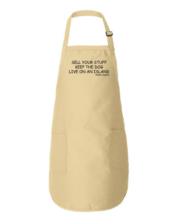 Beige apron with text reading "Sell Your Stuff Keep The Dog Live On An Island -Howard Livingston" on a white background.
