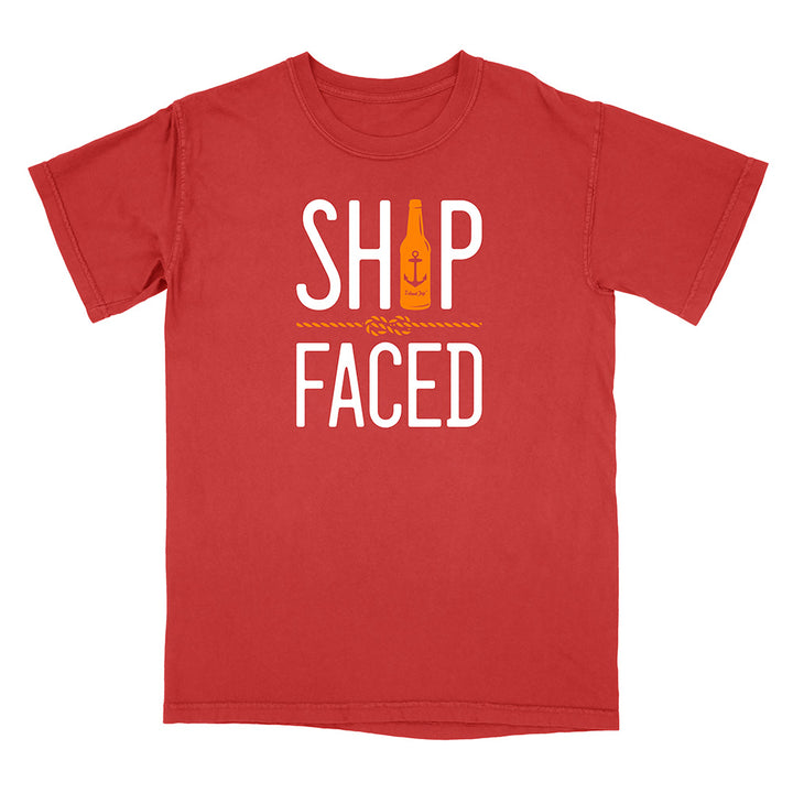 Red t-shirt with 'Ship Faced' text and bottle graphic on a white background