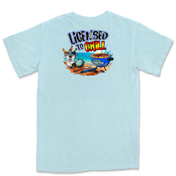 Light blue t-shirt with a graphic design on the back featuring text 'Licensed to Grill' and images of a grill, drinks, and food.
